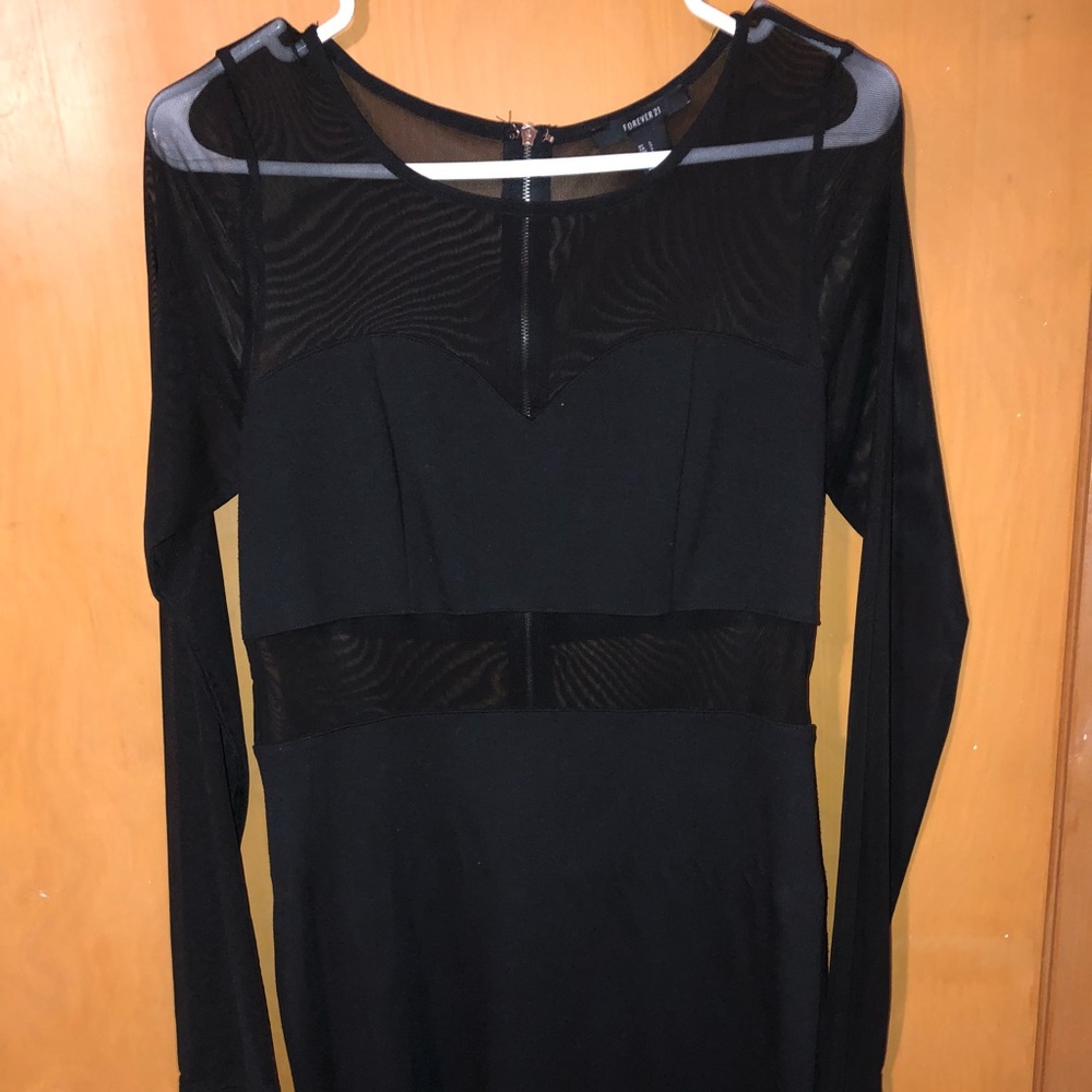 Little black dress with mesh sleeves